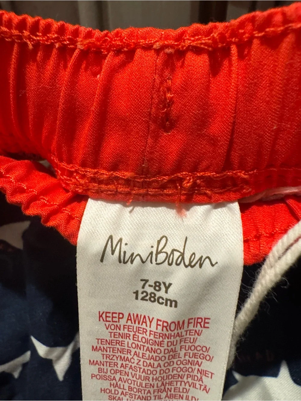 Mini Boden Navy Shark Swim Trunks with Red Waistband